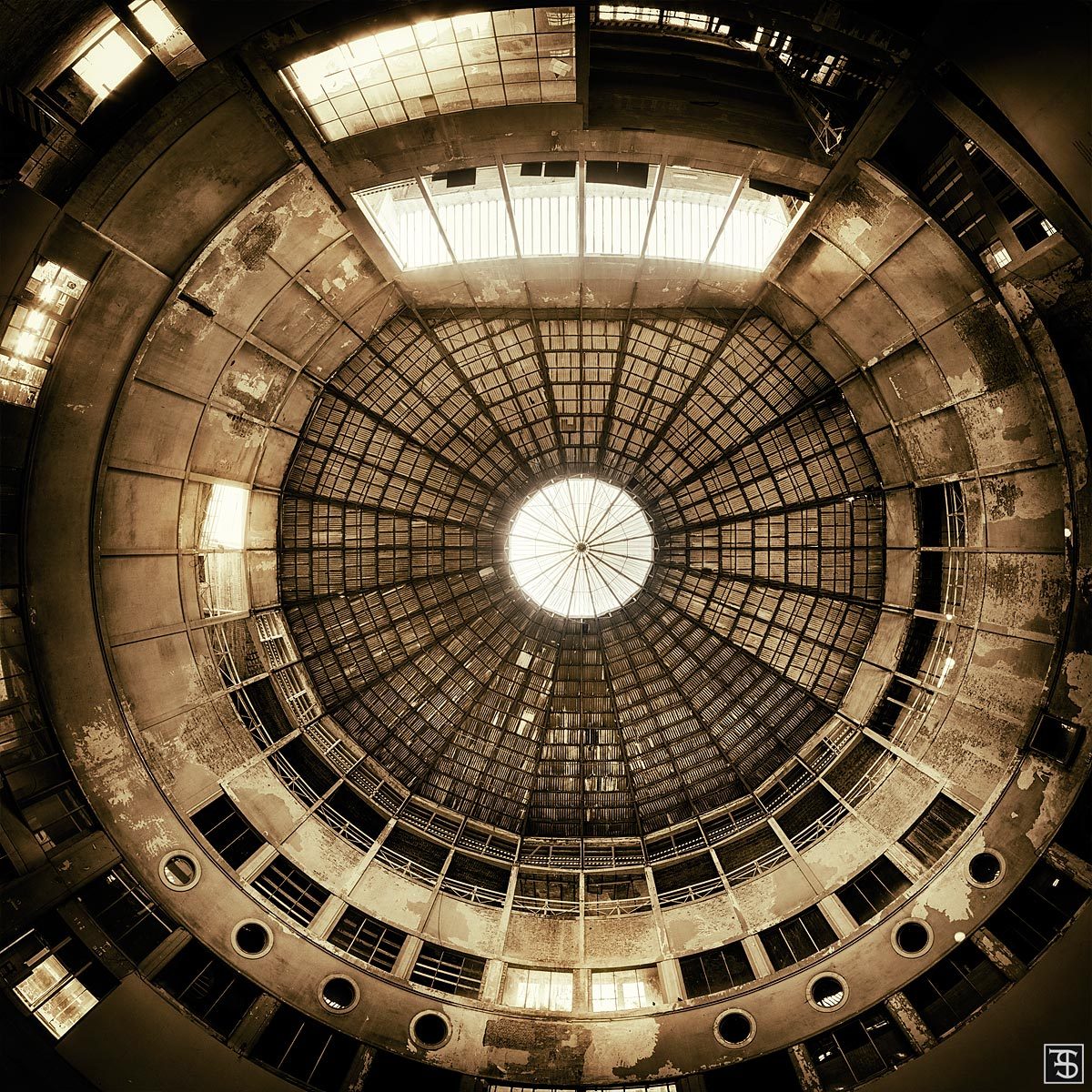 A circular glass dome inside an abandoned winter circus building in Belgium