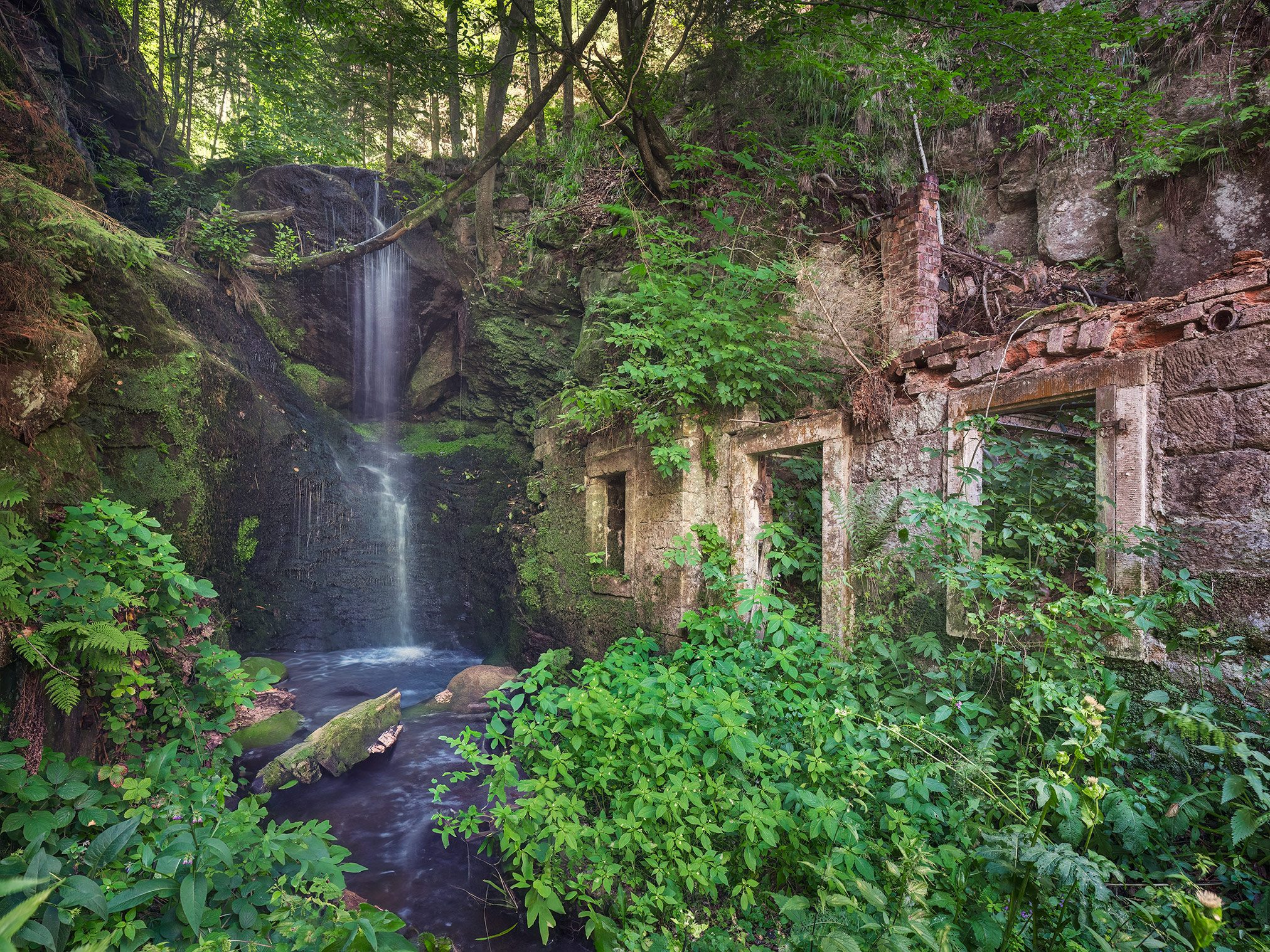 Ruin beside a waterfall in the Elbe Sandstone Mountains, Germany
