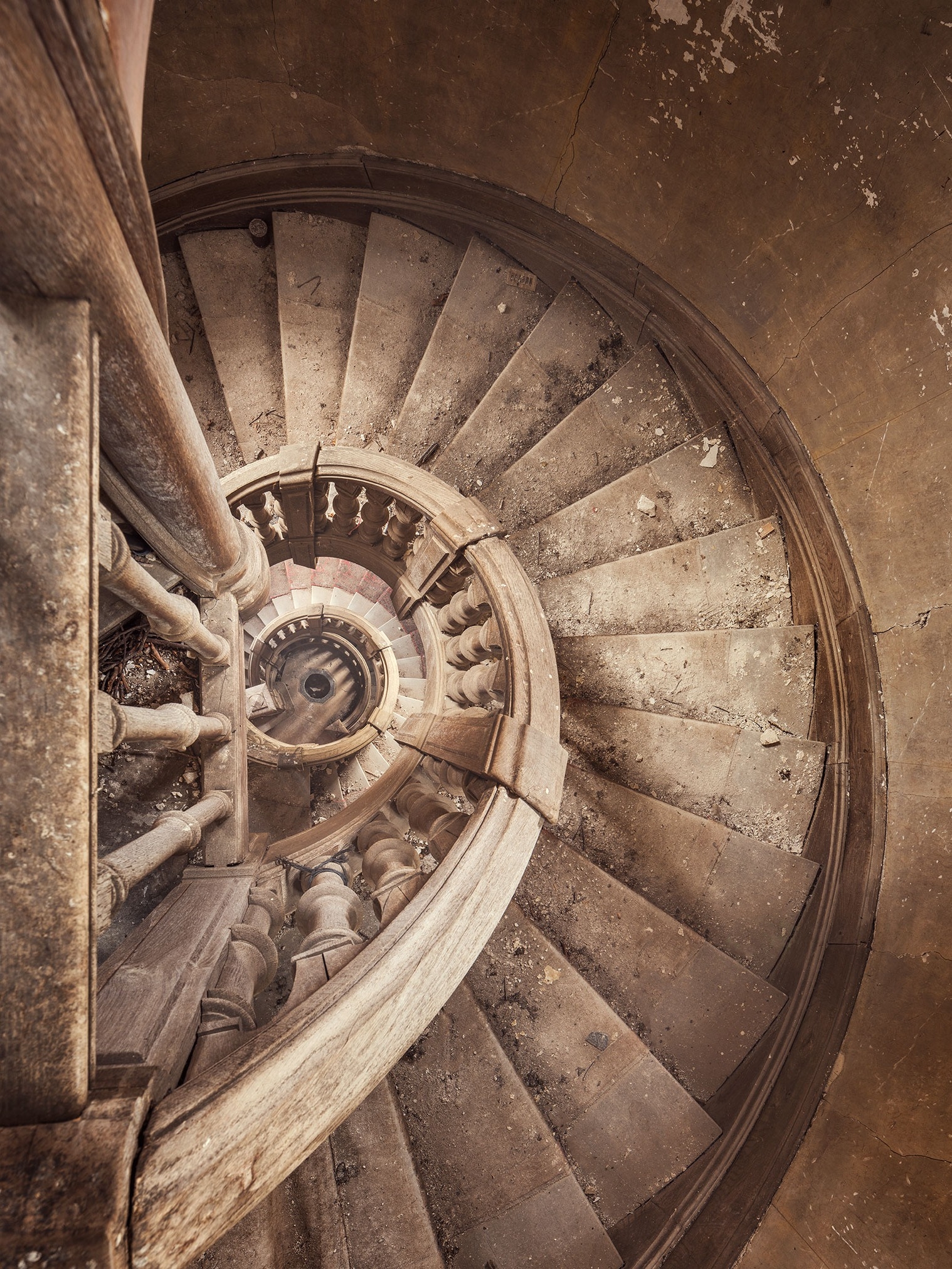 Spiral staircase in an abandoned castle in France